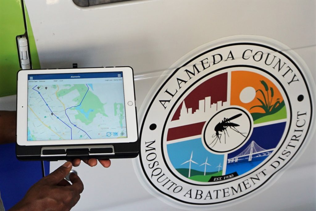 tablet next to alameda county mosquito abatement district logo