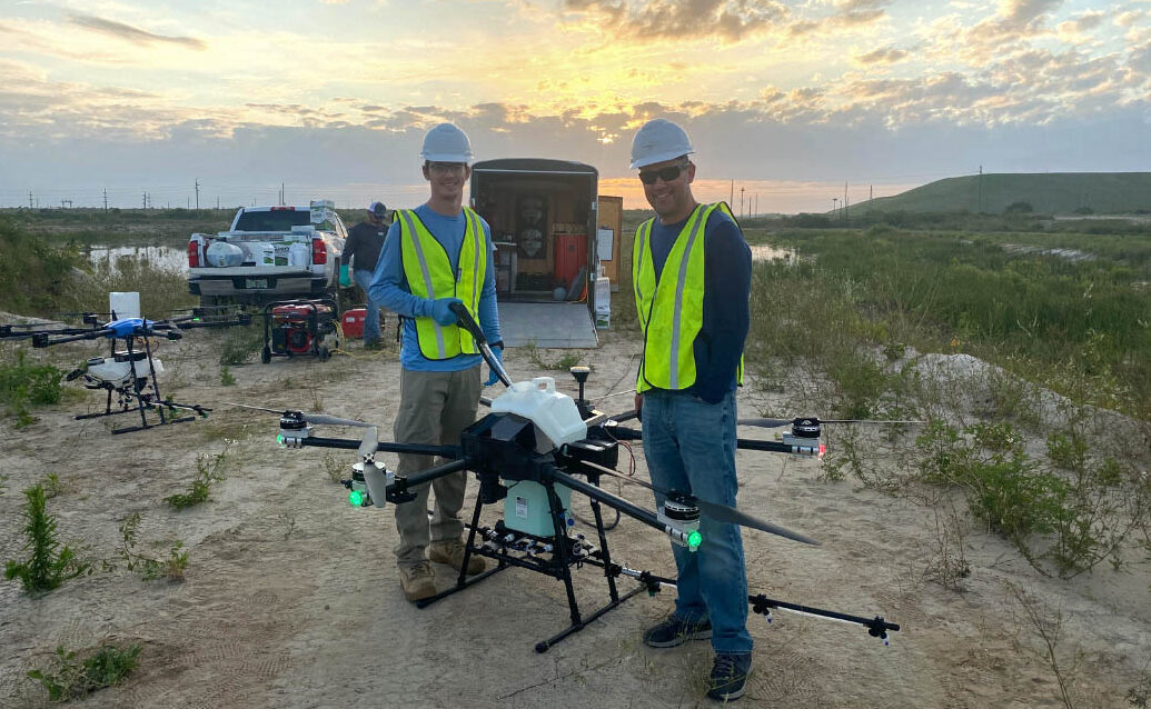 two men with a precisionvision 40 x drone
